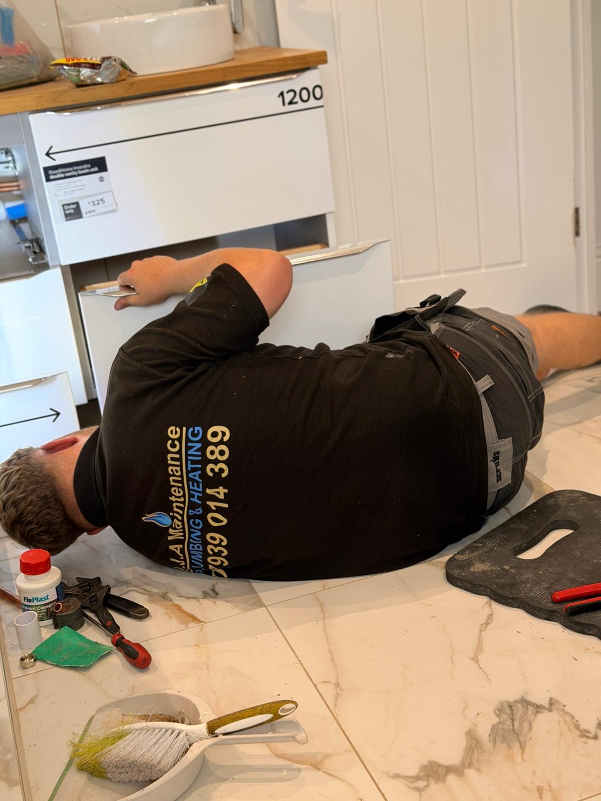 DJA Maintenance engineer plumbing in a double vanity unit